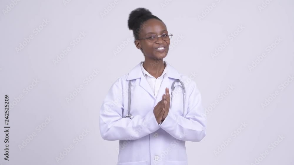 Young happy African woman doctor clapping hands Young happy African woman doctor clapping hands
