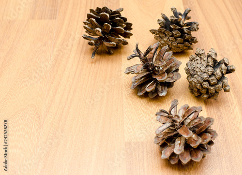 pine cones on a wooden background, natural materials