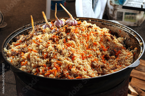 rice with meat.a cauldron full of pilaf