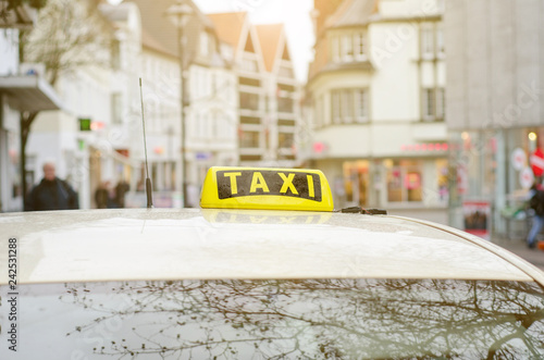 Fototapeta Taxi car in the city.