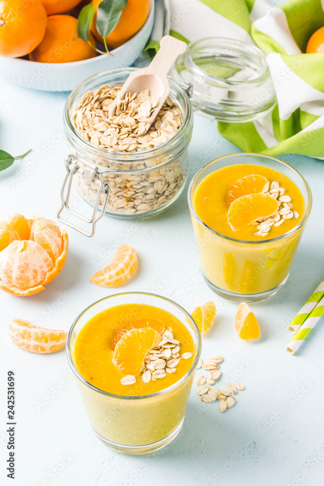 Tangerine turmeric smoothie. Selective focus, space for text. Tangerine turmeric smoothie. Selective focus, space for text.