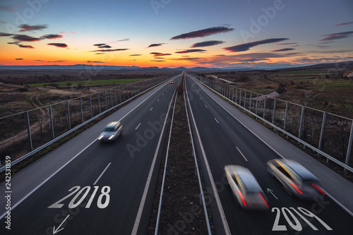 Driving on open road at beautiful sunny day to new year 2019. Aerial view