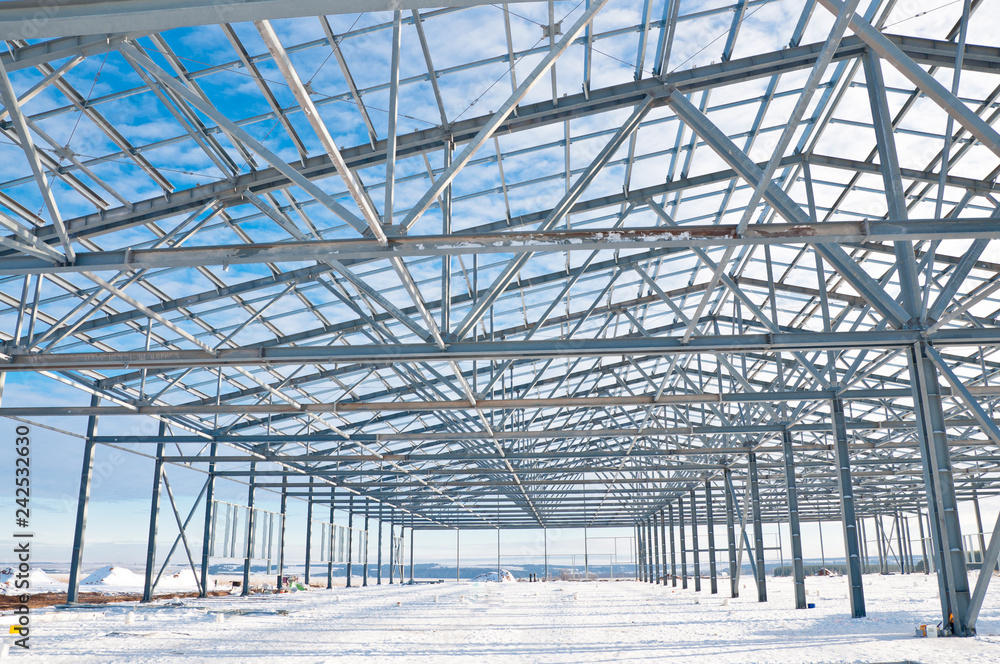 Fototapeta premium Structure of building. Steel construction on sky background