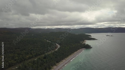 Aerial view of a beautiful beach on the Great Lakes of North America, Lake Superior, during a vibrant sunny day. Taken in Agawa Bay, Ontario, Canada. photo