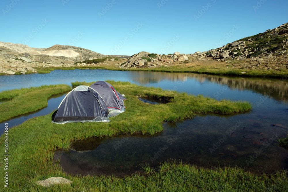 Camping tents on an grassy island at a (Sakligol) Lake, Bursa