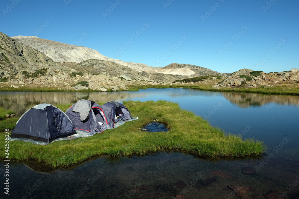 Camping tents on an grassy island at a (Sakligol) Lake, Bursa
