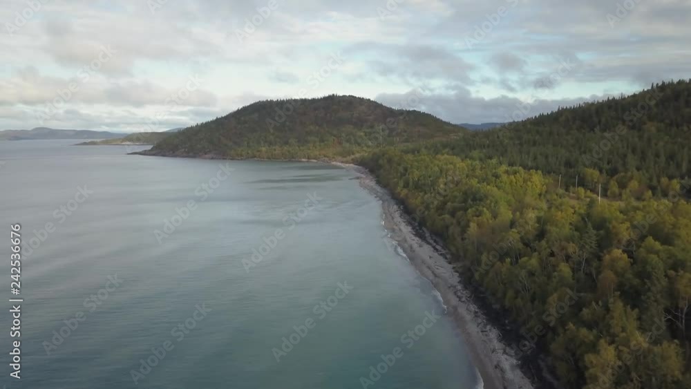 Aerial view of a beautiful beach on the Great Lakes of North America, Lake Superior, during a vibrant sunny day. Taken in Pebble Beach, Marathon, Ontario, Canada. Aerial view of a beautiful beach on the Great Lakes of North America, Lake Superior, during a vibrant sunny day. Taken in Pebble Beach, Marathon, Ontario, Canada.