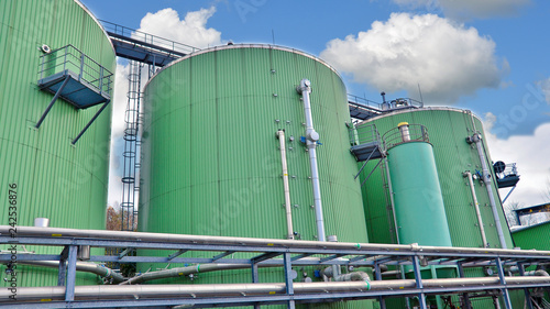Biogas tanks on a biogas plant. Wastes recycling ecology concept. Green economics.