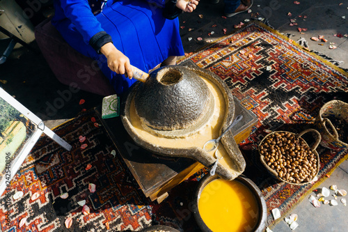 ARGAN OIL. Making of argan oil from argan nuts and seeds in Morocco photo