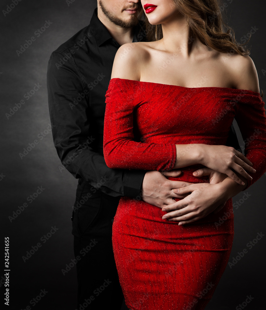 Couple Fashion Beauty, Young Woman in Sexy Red Dress and Embracing Man in Love Stock Photo Adobe Stock photo
