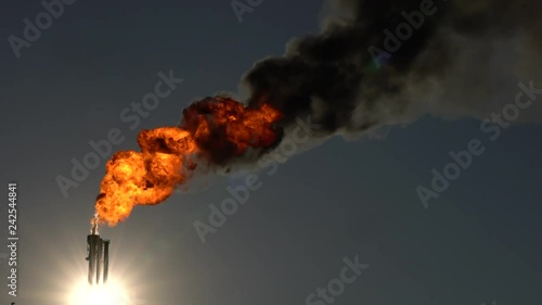 Industrial emissions from a chimney with a lot of carbon black photo