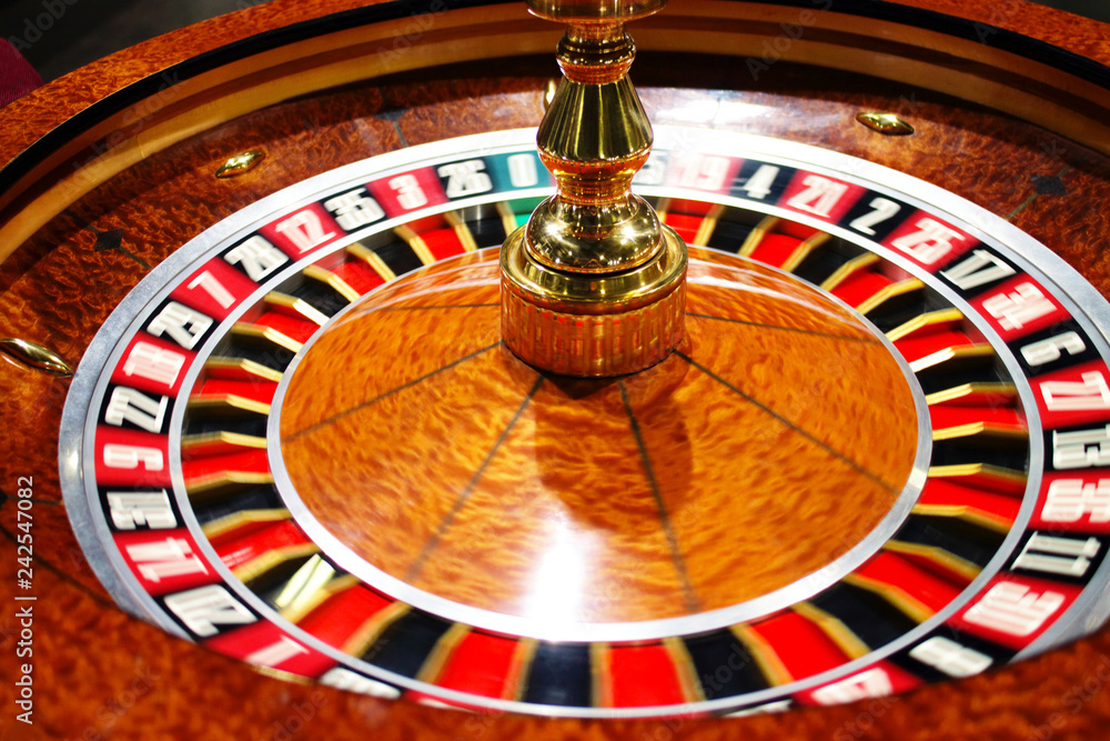 casino roulette in motion with blurry numbers, concept of gambling addiction casino roulette in motion with blurry numbers, concept of gambling addiction