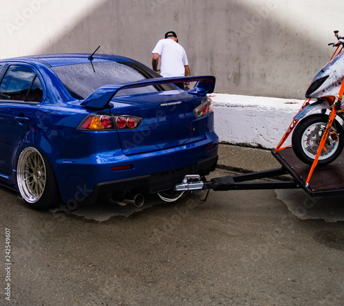 motorcycle towing on a car