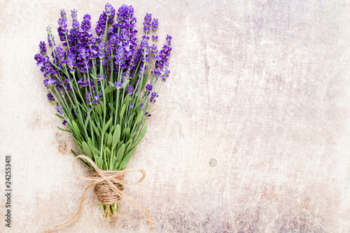Fototapeta Naklejka Na Ścianę i Meble -  Lavender flowers, bouquet on rustic background, overhead.