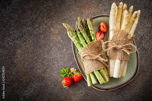Fresh harvest of asparagus and strawberries