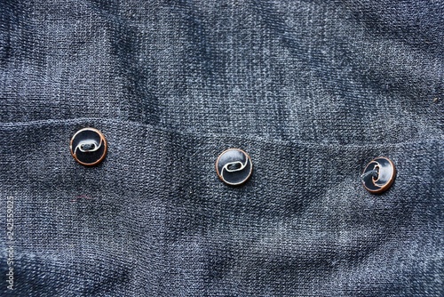 three buttons cloth texture on gray clothes