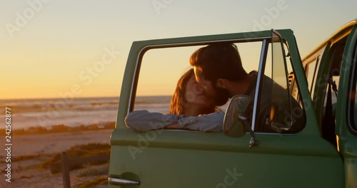 Romantic couple kissing near van 4k