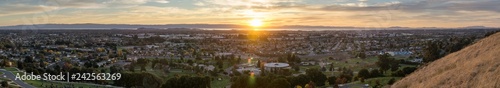Expansive sunset panorama comprising the cities of east San Francisco bay, Fremont, Hayward and Union City, California photo