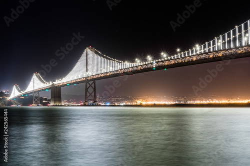 Photography The illuminated Bay Bridge connecting San Francisco and Oakland via Treasure isl