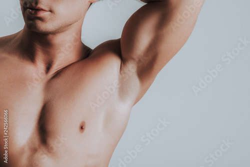 Close up of man showing his armpit while putting arm up photo