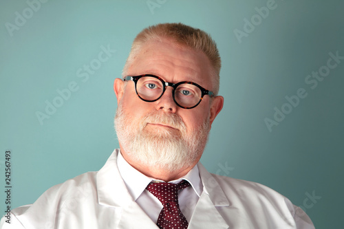 Confident adult doctor looking at the camera photo