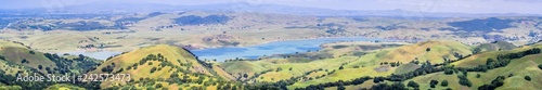 Panoramic view of San Antonio reservoir and the surrounding green hills, Sunol, Alameda county, San Francisco bay area, California