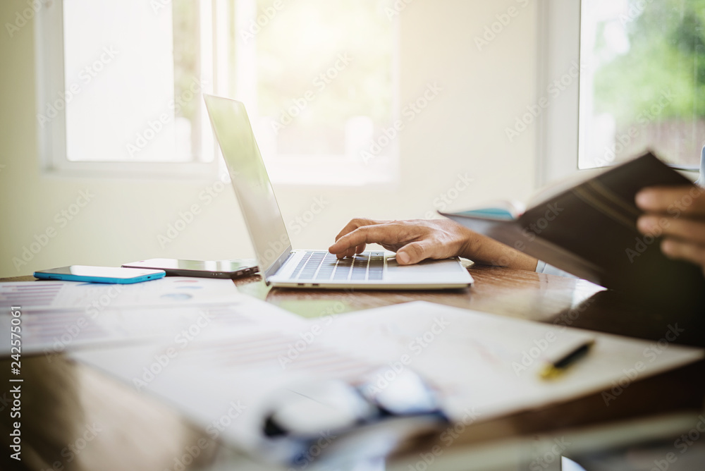 Fototapeta premium Accountant man calculating tax expense financial statement.