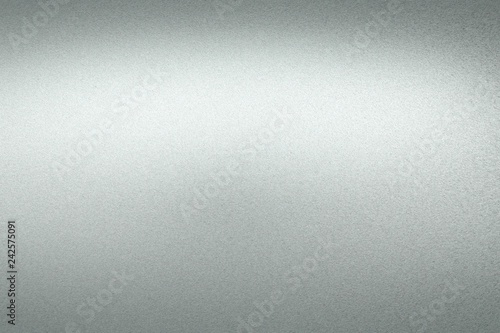 Texture of reflection on rough gray steel panel, abstract background