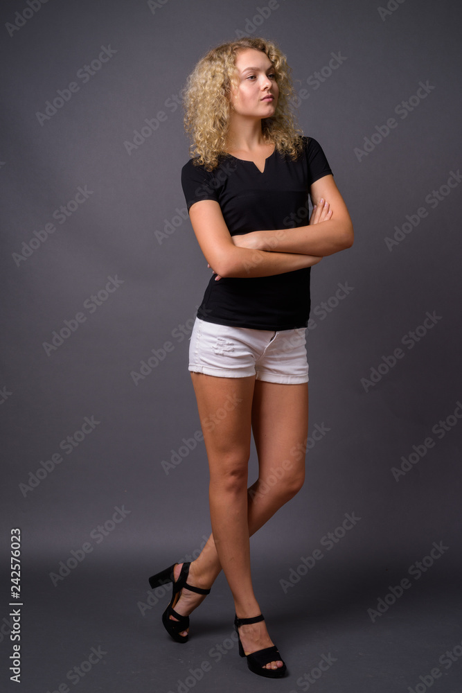 Full length portrait of young beautiful woman standing Full length portrait of young beautiful woman standing