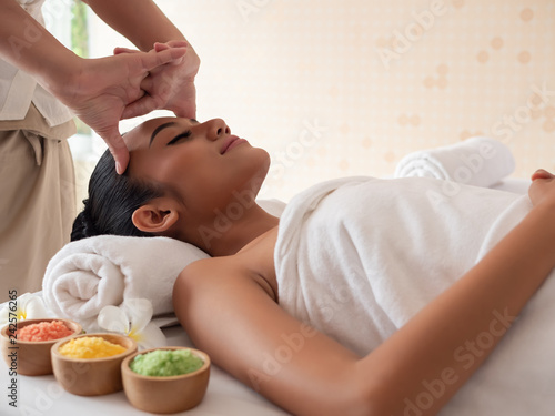 Asian girls are a relaxing head massage in the Spa Salon. Thai massage for health