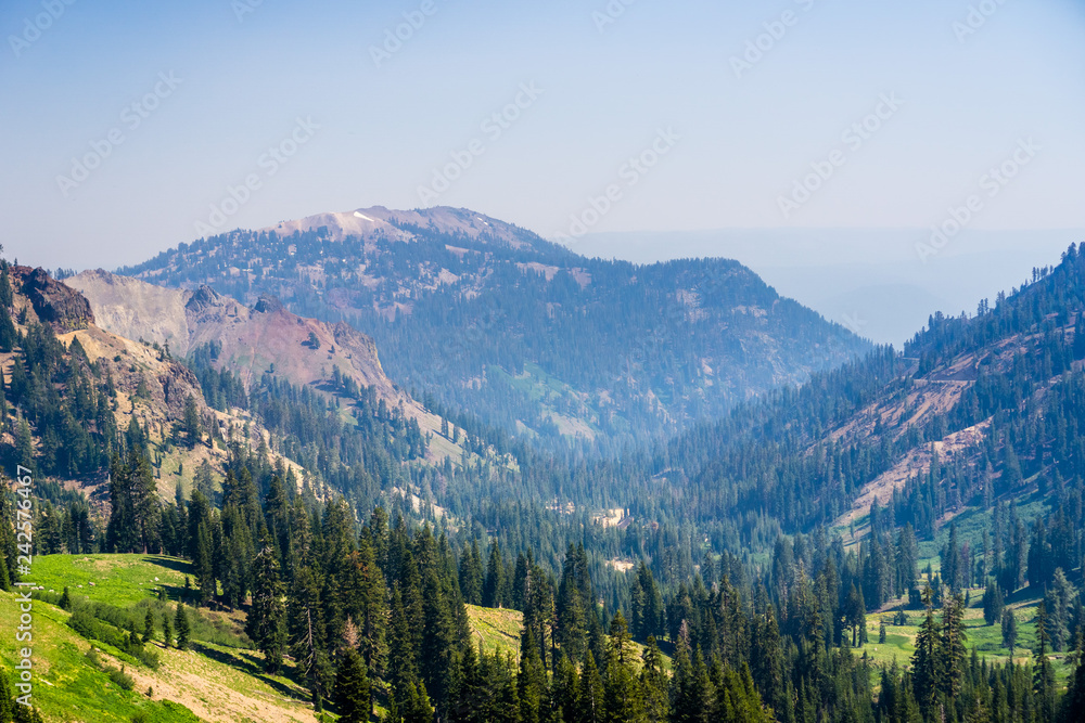 Landscape in Lassen Volcanic National Park with smoke from a nearby wildfire  present in the air; Northern California