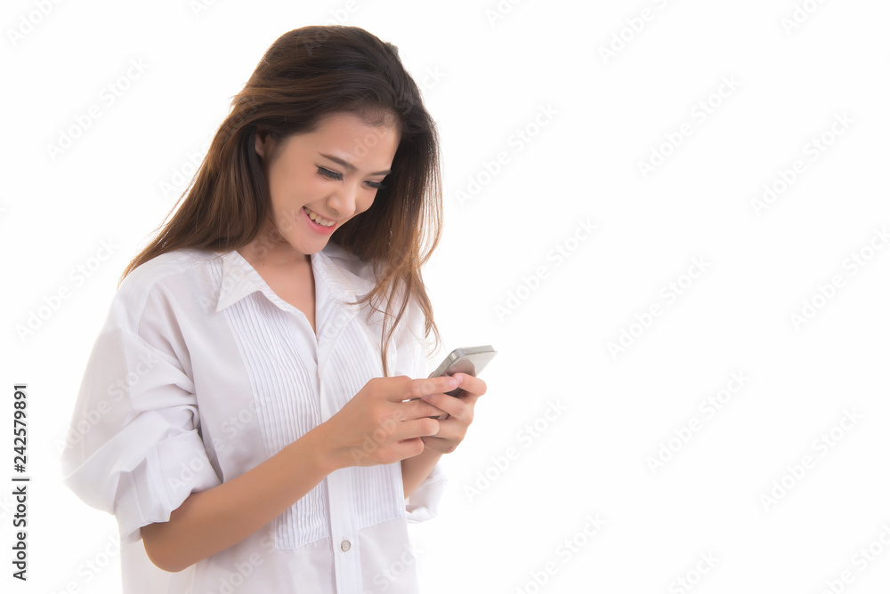 Beautiful asian woman smiling and using smartphone isolated on white background. Thai female happy holding phone in hand free from copy space. Beautiful asian woman smiling and using smartphone isolated on white background. Thai female happy holding phone in hand free from copy space.