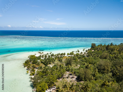 Fototapeta Naklejka Na Ścianę i Meble -  Aerial image from a drone of blue lagoon and Otemanu mountain at Bora Bora island, Tahiti, French Polynesia, South Pacific Ocean (Bora Bora Aerial).