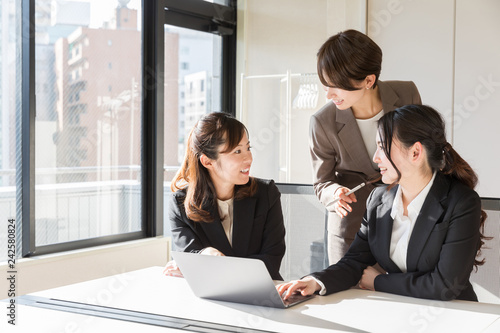 asian businesswomen working in office photo