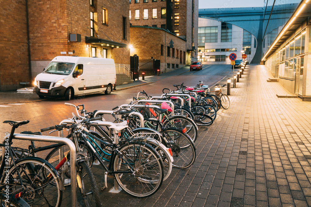 Helsinki, Finland. Bicycles Parked Near Storefronts In Postgrand