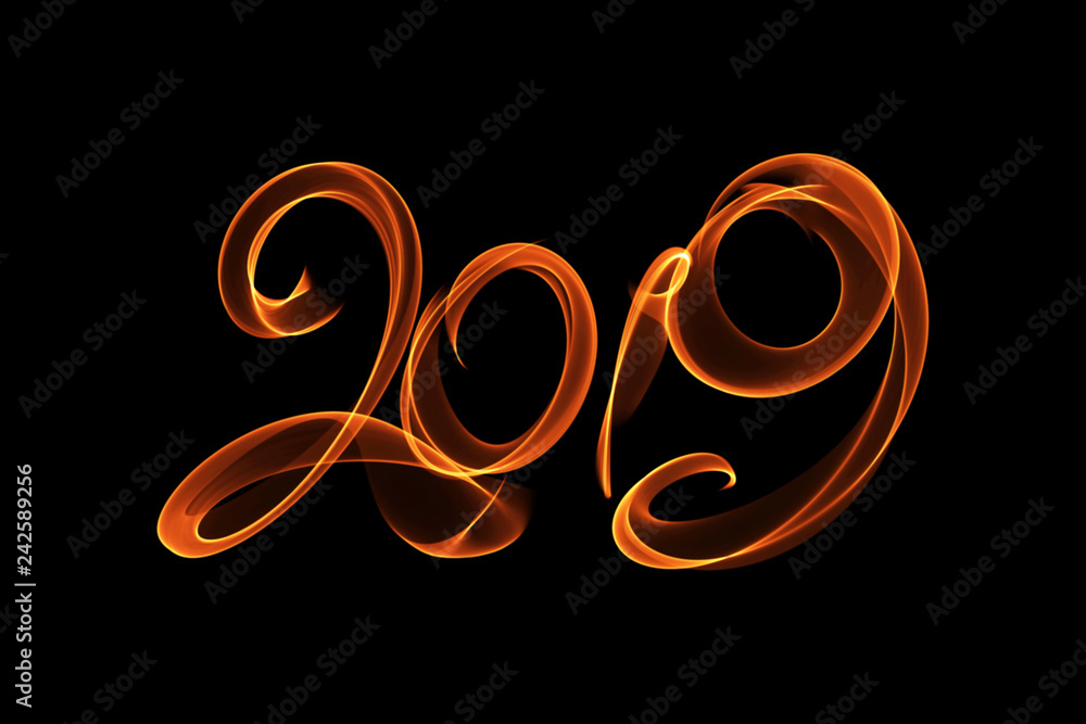 Happy new year 2019 isolated numbers lettering written with fire flame or smoke on black background Happy new year 2019 isolated numbers lettering written with fire flame or smoke on black background