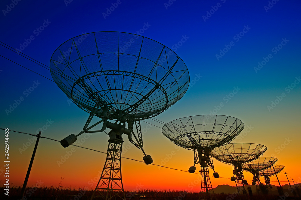 The silhouette of a radio telescope observatory The silhouette of a radio telescope observatory