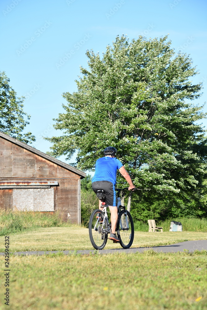 Retiree Male Cyclist And Exercise Riding Bike