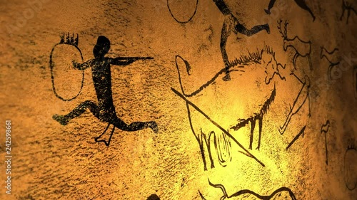 Candelight fire dances over cave paintings in prehistoric cavern - V2