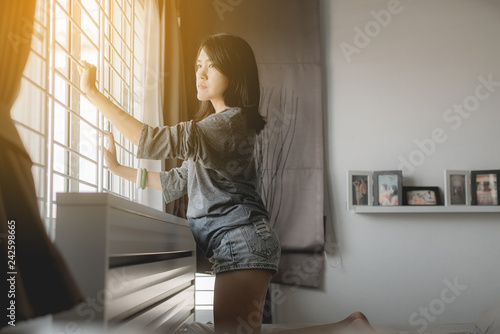 Asian woman feeling unhappy and confused problem in personal life,Unexpected pregnancy concept photo