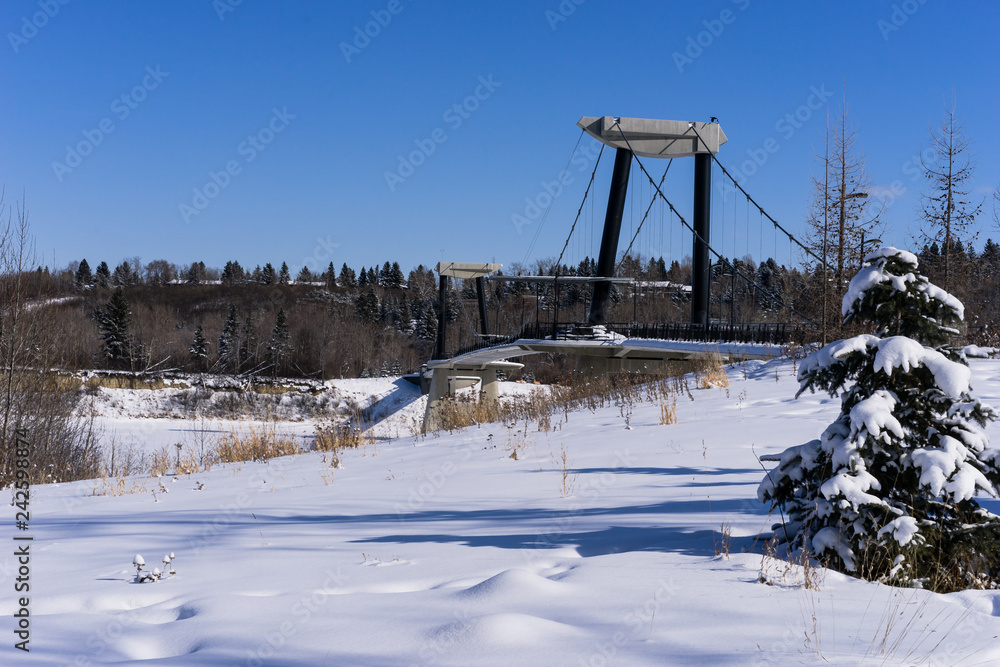 Fort Edmonton foot bridge in winter season sunny day with blue sky background Fort Edmonton foot bridge in winter season sunny day with blue sky background
