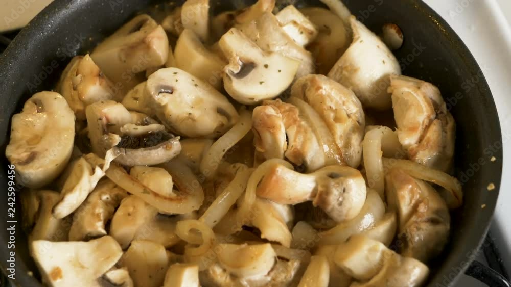 champignon mushroom roasting on pan with onion
champignon mushroom roasting on pan with onion