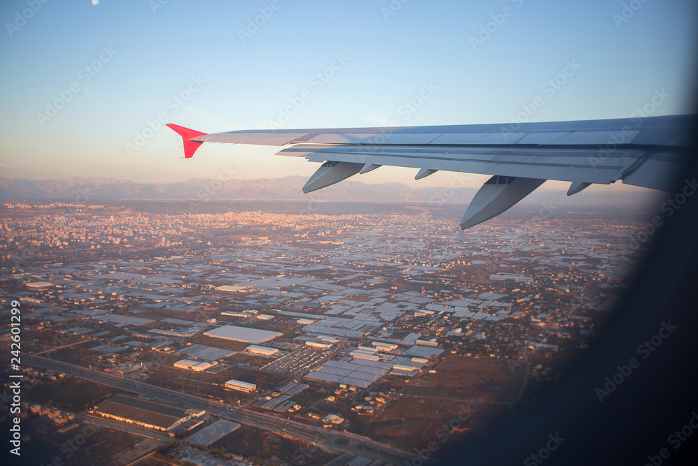 Fototapeta premium City panorama from height of bird's flight. A view of the city from a plane window.