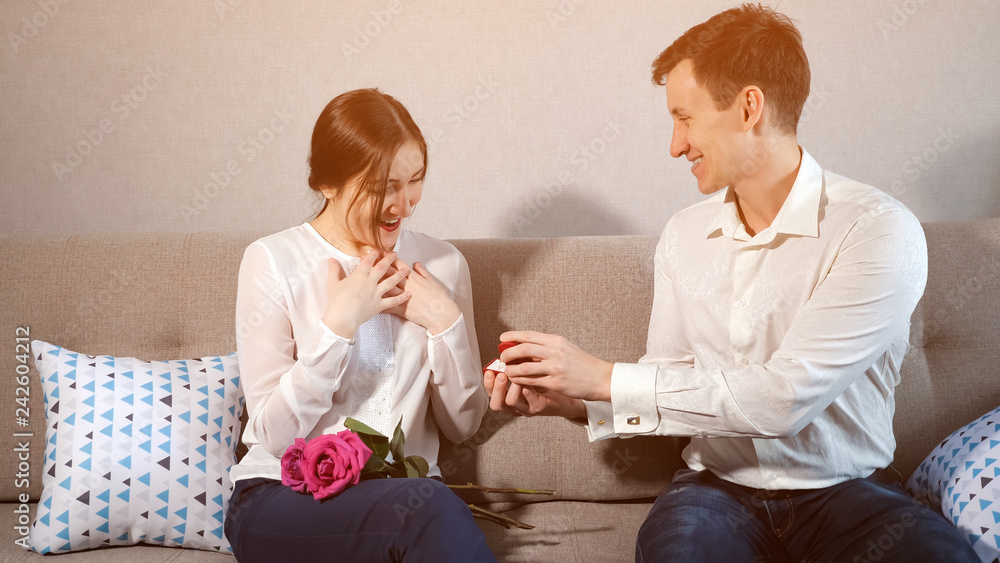 Boyfriend proposing, giving wedding ring to beloved girl. Boyfriend proposing, giving wedding ring to beloved girl.