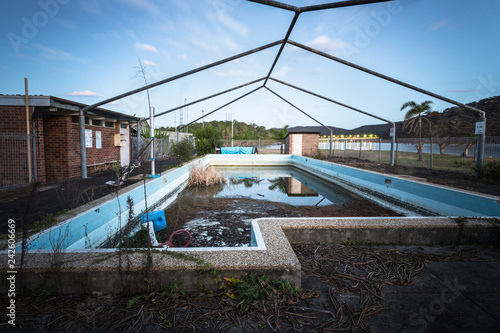 Abandoned forgotton swimming pool photo