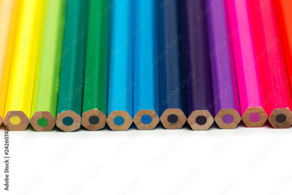 Colour pencils on white background, top view. Colour pencils on white background, top view.