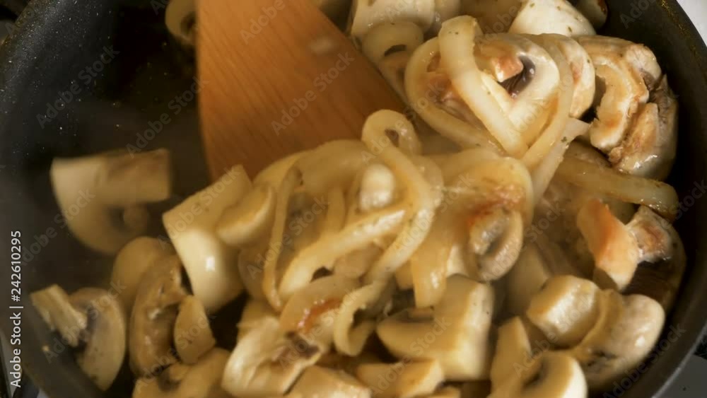 champignon mushroom roasting on pan with onion
champignon mushroom roasting on pan with onion