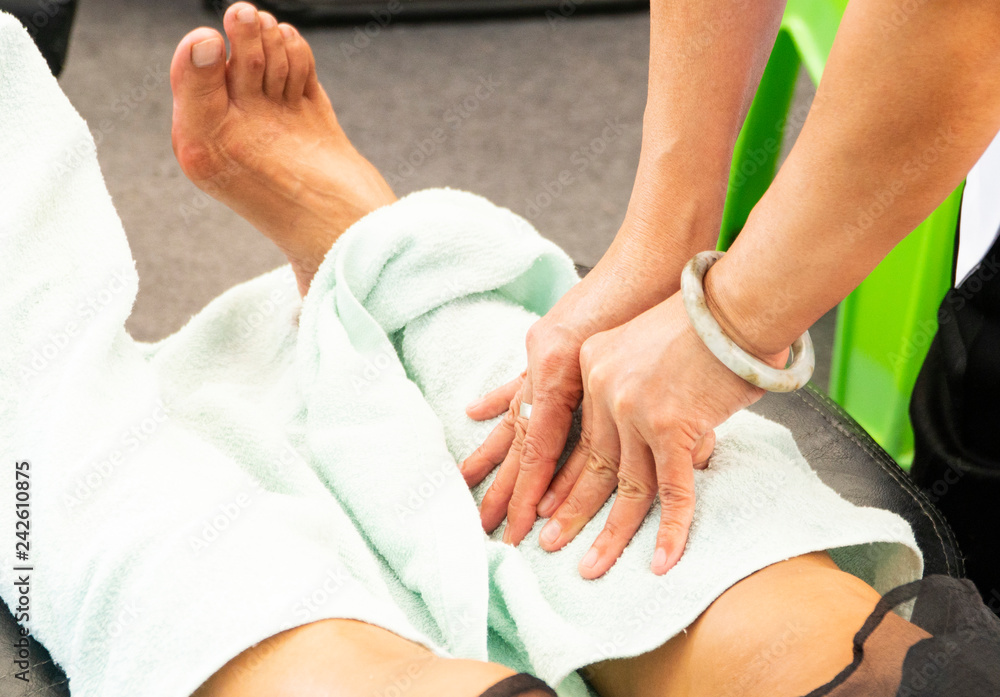 Thai massage; a traditional body treatment of reflexology made by professional therapist for physical relaxation and healthy wellness. Thai massage; a traditional body treatment of reflexology made by professional therapist for physical relaxation and healthy wellness.