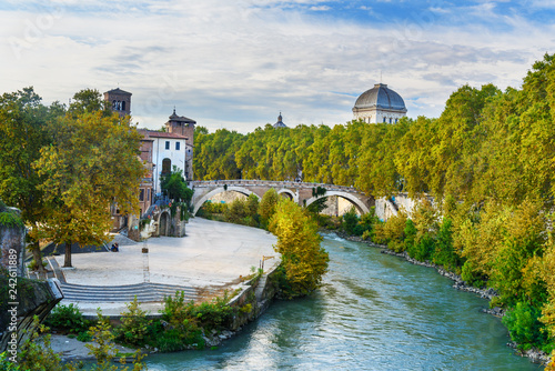 View on Isola Tiberina or Tiber Island and Ponte Garibaldi bridge. Rome. Italy photo