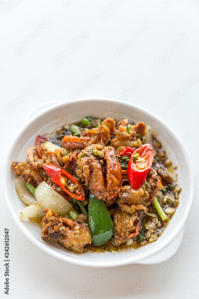 fresh soft crabs cooked in black pepper sauce on white backgroun fresh soft crabs cooked in black pepper sauce on white backgroun